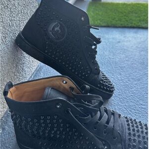 Black High-Top Christian Louboutin with spikes. Barely worn